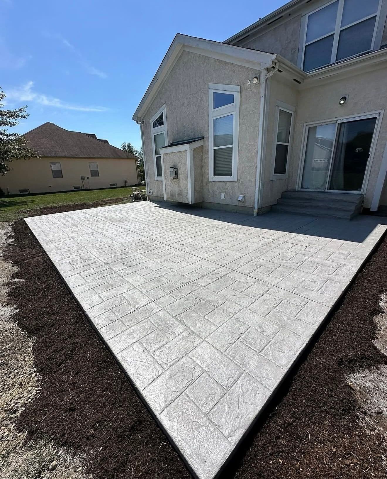 Gallery photos for Stamped Concrete Patio Built for Real Backyard Life: Image #1