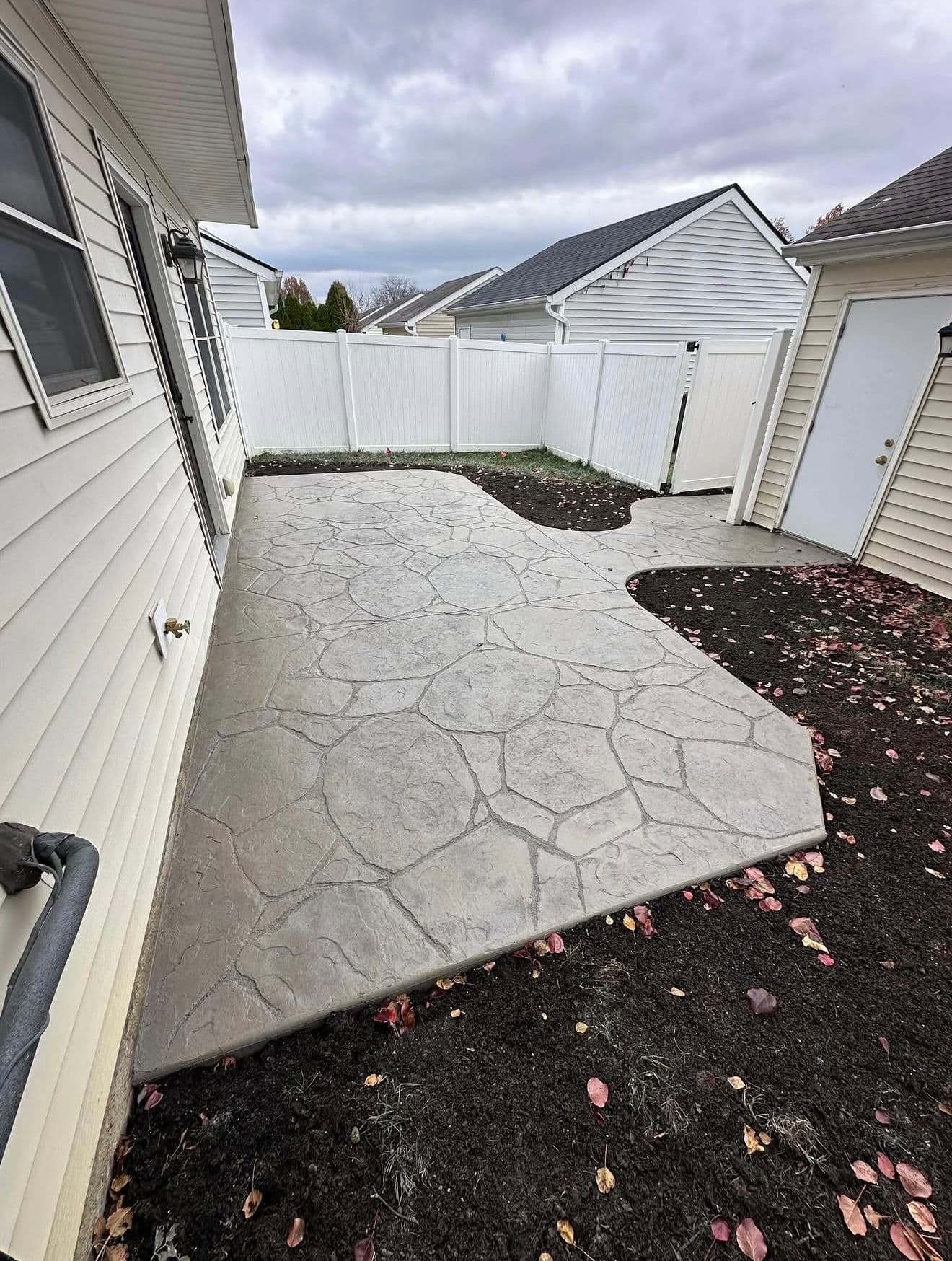 Stamped Concrete Patio With Natural Stone Texture Changes the Whole Backyard image