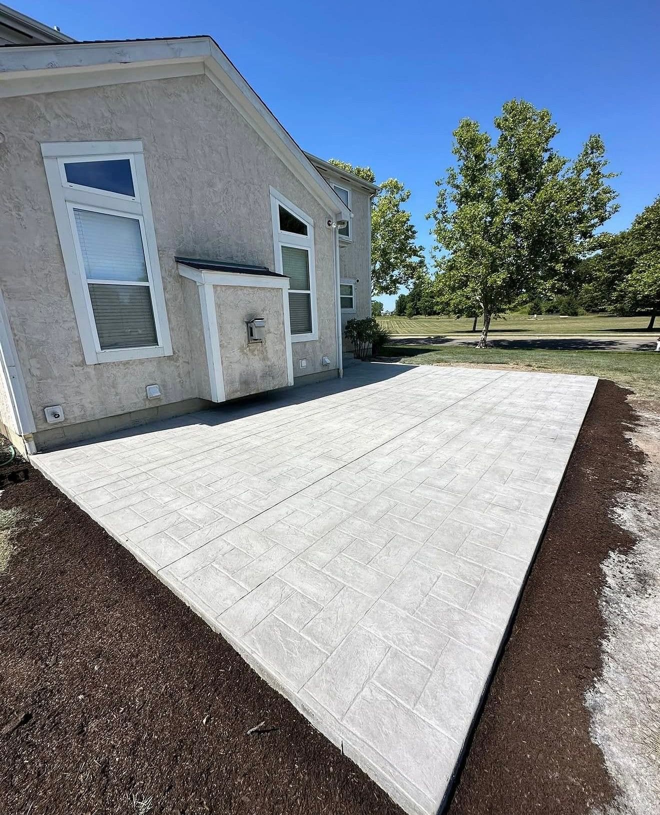 Gallery photos for Stamped Concrete Patio Built for Real Backyard Life: Image #2